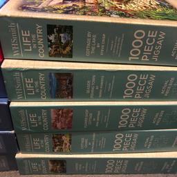 10 x 1000 piece WH smith puzzles. £10 the lot all unchecked collection Cobham