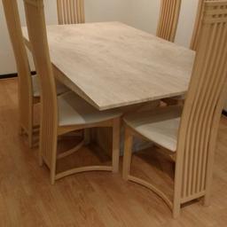 Solid marble effect dining table and 6 chairs. Tiny chip on one corner, good condition. Buyer collects.