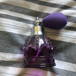 Purple glass perfume bottle. Never used, only for decoration.