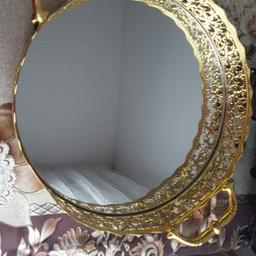 Perfect for an occasion. Used once. Gold ornate. Small mark on the edge of the mirror which is not very noticeable.