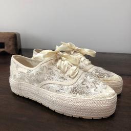 Very cute espadrilles with embroidered cream lace and cream ribbon, from France.

Good condition, worn only a few times. However, does have a few visible glue marks (as seen in the photos) due to their age.
Size: 37 (UK Size 4-4.5)