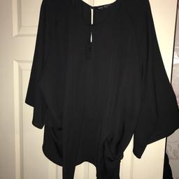Brand new no tags though .. size 18 pretty little black blouse with zip at the back