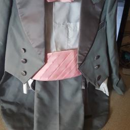  pageboy suit 5 piece ... jacket and trousers .size 8 yrs old white shirt. 8 yrs old clip pink dickybow and pink waist slash .only used once . excellent condition . collection only ..selling for someone else so don't insult by offering silly offers