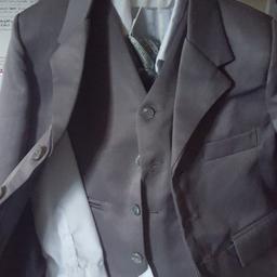 5 piece boys page boy outfit . suit in grey used once . complete jacket,waist coat,trousers shirt, elastic bow tie., will need cleaning been stored . grab bargain selling for someone else . no silly offers they will be ignored  woodside telford  collection only