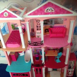 Barbie 3 floor dream house , come's with everything you see in photos , has a pool attached to one side of the house and a lift on the other end of house , this house is approve 3 ft high, the garage door has came off but can easily be put back on and in two of the room's a little bit of the wall paper has came off due to my daughter picking sticker's on their, which I have shown in last two photos, I also have the box which house came to, this cost me £250 so I'm asking a fair price of £90