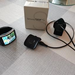 Here I have a Samsung Gear S, in good condition. Has a few light scratches but are they are barely noticeable and don't affect the use. Complete with fully adjustable strap, power lead, adapter and box. Watch has been reset so all you need to do is download the gear app and connect the watch to your phone and away you go. 

In my opinion these are one of the best smart watches you can buy as you can put your SIM card inside and use it as a phone. 

Any questions please ask.
