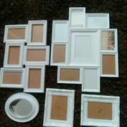 Selection of white plastic photo frames and small oval mirror. 
Collection only from Rochester, Kent.