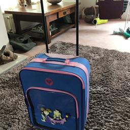 Small suitcase with extendable handle and wheels
