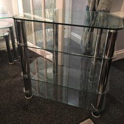 Tv or hi fi stand. 4 shelves with chrome stands. Height 60cm width 60cm depth 45cm.
Matching nest of glass tables available too. (£15) but unit and tables for £25!