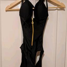 Woman's Black Swim wear. Size: 10. New without tags