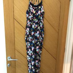 Age 9 yrs. black and floral jumpsuit from New Look. Elasticated at ankles. Excellent condition.