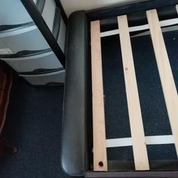 Single bed leather headboard with timber slats. Can dismantle for transport in a car. 2ys old