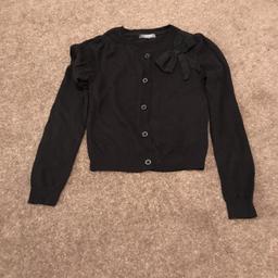 Age 9-10yrs girls black cardy with glittery black bow attached on one side from M&S. excellent condition