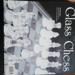 GLASS CHESS SET NEVER USED.