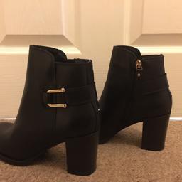 Genuine Brand new Black leather heeled boots with buckle and zip fastening.
Size 5/ 38