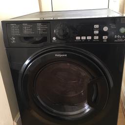 Black Hotpoint Aquarius washer dryer. Shows error code F05. Can be fixed. Has a glue stain. 8