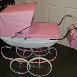 Limited edition pink dolls silver cross pram, glitter effect, excellent condition few tiny marks on but hardly noticeable, comes with mattress, pillow mattress, bag, rain cover and princess doll, and also has the authentication certificate and user manual, comes from pet and smoke free home