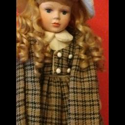 My name is Molly, made by Leonardo Collection.
Beautiful Porcelain Doll, Excellent Condition. Complete with Stand!
SIZE: Doll Aprox 20" plus stand.
HAIR: Long blonde curls / ringlets absolutely stunning.
EYES: Blue.
DRESS: Brown & cream tartan pattern dress with matching bonnet and scarf.
Complete with all accessories, beautiful Porcelain face, arms and legs with soft body.
Extremely well looked after, looks new. Not suitable for under 14 year old.
