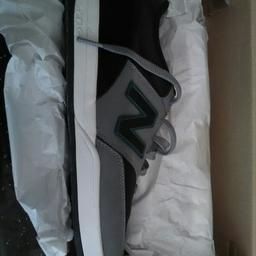 Brand new mens New Balance size 9 grey, black and green also come with spare laces.