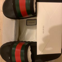 Hello I am selling my Gucci sliders these are in pristine condition i have only wore these once I have the original purchase receipt from Gucci 100% genuine if still in doubt we can meet at a Gucci store in London of your choice to confirm authenticity these are a size 9 cash on collection please thanks for viewing😊