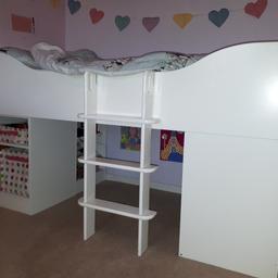 Children's Aspace Cabin Bed in white. Bed has removable ladder to make easy access to the den / play area area under the bed which also encorporates 2 shelfs for handy storage. There are also two more shelves at the front of the bed to store toys / books. At the bottom of the bed there are two deep drawers which are ideal to store bedding or clothes. Bed was over £350 when new. Grab a bargain before Christmas.