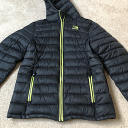 Hardly worn black karrimor coat with green/yellow inside and on pockets. 
Size Boys age 13.