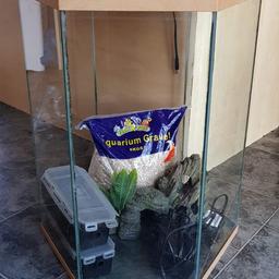70lt fish tank comes with everything you can see in the tank. gravel, pump, ornaments