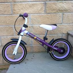 Girls balance bike with back brake. Good condition. Few scratches as detailed in pictures but in full working order. Great little bike and gets toddlers using brakes unlike other balance bikes. Adjustable height seat. Includes matching bike lock.