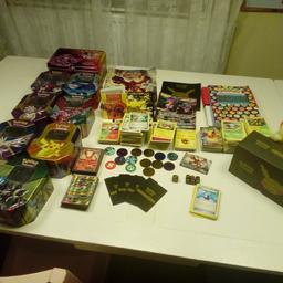 Job lot of pokemon cards + accessories (8 tins, coins, 2 books, guides, dice, generations elite trainer box) lots of cards( a few doubles but not sure how many) 30+ EX, GX, Break cards. Also 1 small  binder full of cards + 2 large cards + lots or holos and reverse holos. All in good condition!