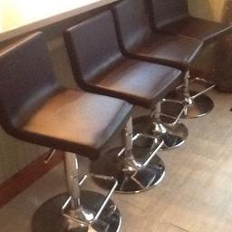 Price for 4 bar stools . Brown Faux leather and all in working order. Height adjustment on each from 60 cm upwards. Great condition.