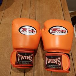 Twins boxing gloves 16oz. No rips or tears in the leather. minor marks from punch bags and mitts but im sure they can buffed out. Retail at £90.00 on most e-bay sites. Hardly used in all fairness, only for sessions with sparing as i have lighter 14oz gloves.