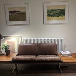 A very rare 2-seater sofa and side tables, designed by Robert Heritage 1972. Part of the Q range, originally designed for the QE2 ship.
2550mm x 750mm x 650mm (seat height 350mm). Original brown leather upholstery, with walnut side tables and aluminium leg frame. As the photos show, there are expected signs of wear on the seat pads and upholstered corners and there is a water stain on the back / top. The seat has been restrung with new webbing (as original).
Buyer to collect. Thanks!