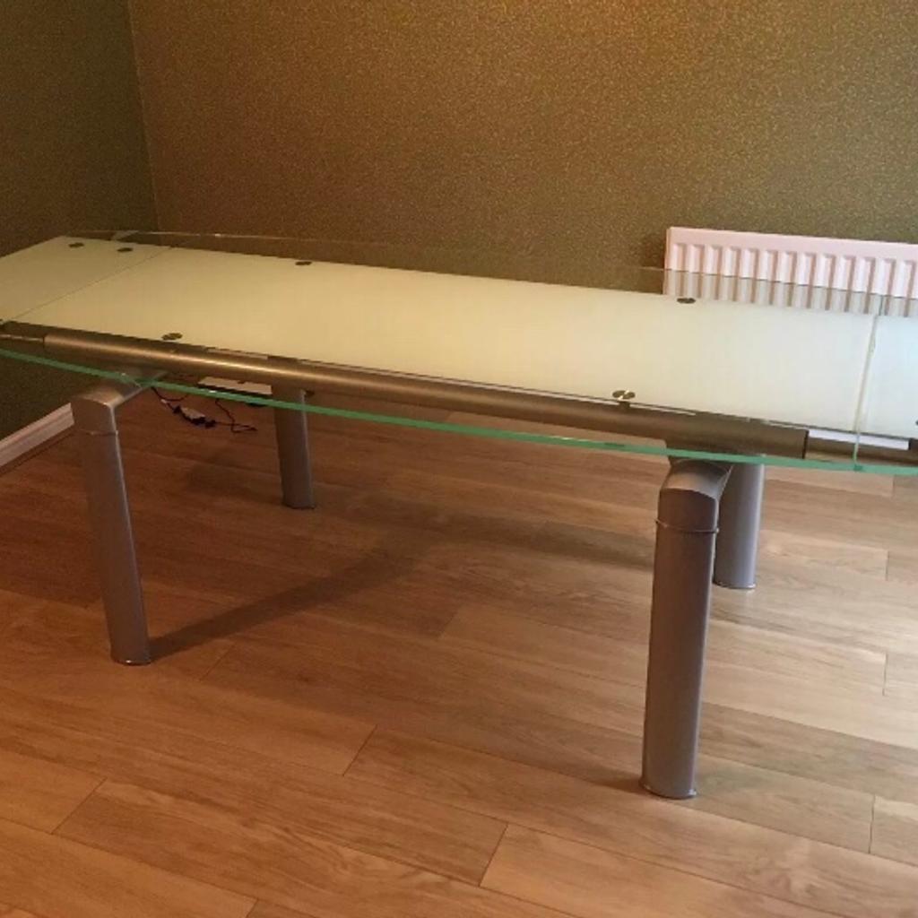 Glass extending dining table +4 leather chair in London Borough of
