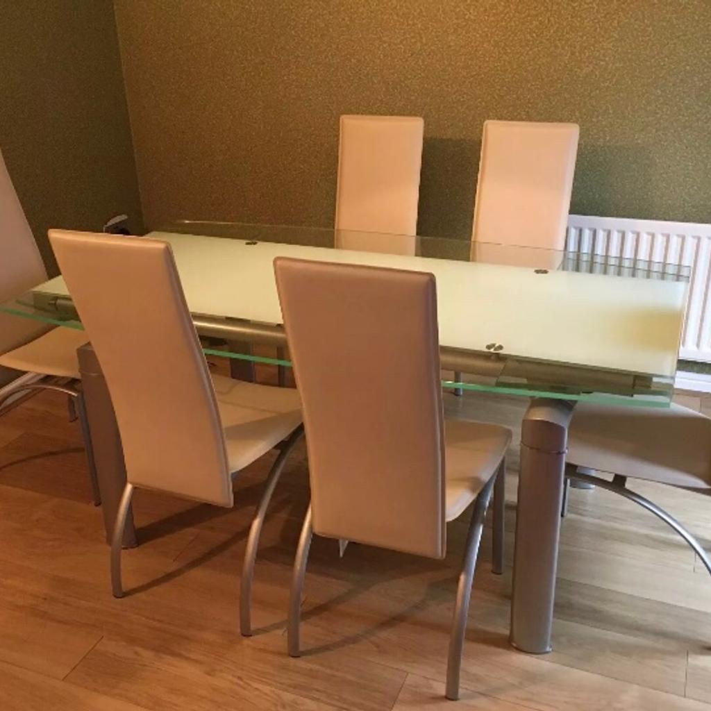 Glass extending dining table +4 leather chair in London Borough of