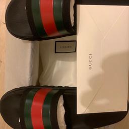 Hello I am selling my Gucci sliders these are in pristine condition i have only wore these once I have the original purchase receipt from Gucci 100% genuine if still in doubt we can meet at a Gucci store in London of your choice to confirm authenticity these are a size 9 cash on collection please relisted due to a time waster thanks for viewing😊