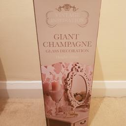 beautiful large champagne glass, 50cm in height, lovely diamonte detail with pink ribbon, i had these as centre pieces at my wedding filled with sweets, I have 8 of these and 2 of the giant wine glasses, price listed is for 1 Glass only, can be sold as a bundle or individuallay.