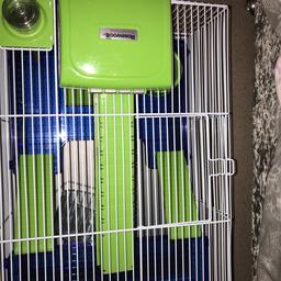 Blue&green hamster cage. Some scratches(non major). 4 floors(including sleep space)Includes food bowl, drinking bottle and a wheel. Used before