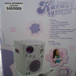 Goodmans Karaoke machine ,instructions, scart lead , 2 micophones ( 2nd one bought separately) , 4 Karaoke CDs ( 3 bought separately ) . Great fun for a family sing a long.Words are shown on TV with each song .All in original wrappings .Bargin £45