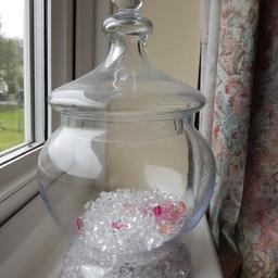 Big storage glass jar with confetti.