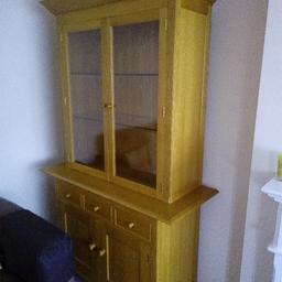 lovely display cabinet,cost £1500 when new.
Comes in 2 pieces. Top cabinet has 2 down lighters. Stunning piece of furniture
Top has a nick bottom right at front see picture. I just put candles either side and it hides it.
There is a mark on top front of doors which can easily be covered with coloured polish.. Just being honest
No offers thanks