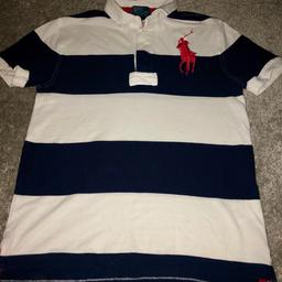 Genuine Ralph top size M which is Age 10-12   Navy and white in good worn condition buyer must collect.