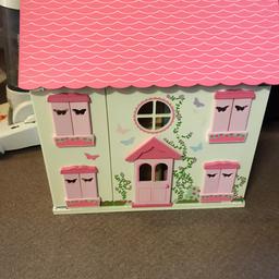 Wooden dolls house with furniture. Part broken off as seen in pics but doesn’t effect the use. In good condition other wise just needs a clean.