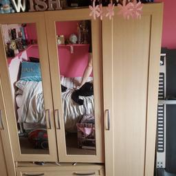 Beech effect wardrobe with mirrors.  Loads of storage.  Drawers slightly damaged as well used  but if you are good at DIY they can be fixed, apart from that good condition... buyers must dismantle and collect from Welwyn Garden City.