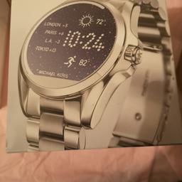 Michael Kors Silver Access Smart watch. Brand new in plastic seal. Selling as I would prefer Hauwei Smart Watch.