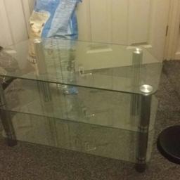 glass & sliver TV stand it will hold upto 32 - 34 inch TV, in very good condition.