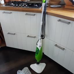 uses steam to clean floor and carpets. Comes with 2 cloth heads for hard floors.