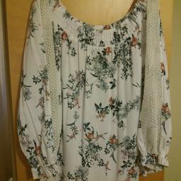 Brand new but no tags. Size 16. off the shoulder top with ling sleeves . extra for postage