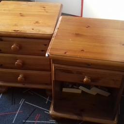 Two wooden bedside tables one with pull out tray