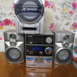 Don't have the remote so seem to be unable to tune in the radio or turn off the bass but someone may know how.
Otherwise 5 disc changer plus 2 tapes and aux. Blue lights flash as the music plays.
In good condition just sat unused now