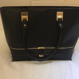Black Bag in great condition (Slight mark near inside button - picture available) 
Inside phone pocket and small zip compartment